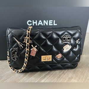 CHANEL
Aged Calfskin Quilted Lucky Charms 2.55 Reissue Wallet On Chain/WOC Black
